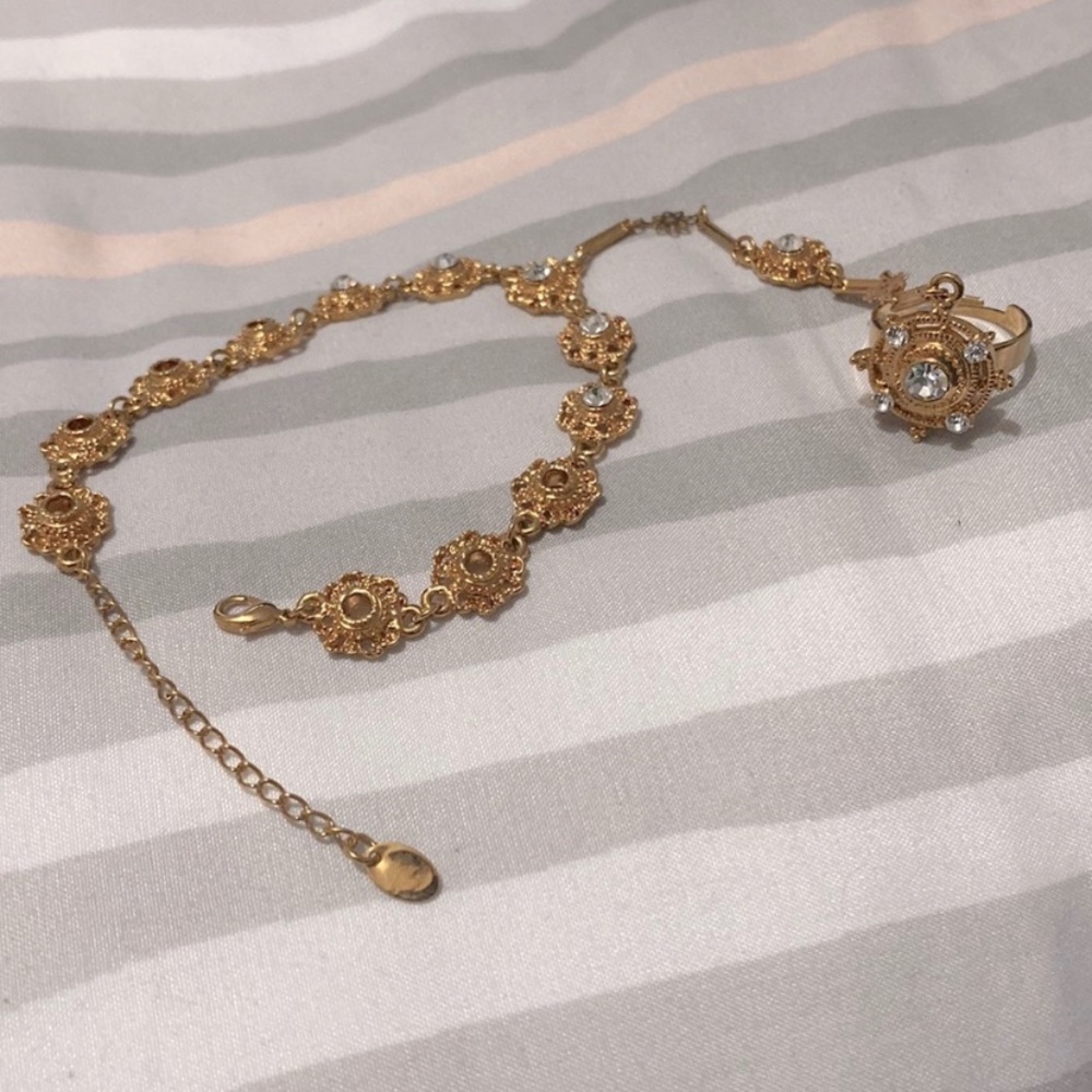Bracelet with adjustable ring attached